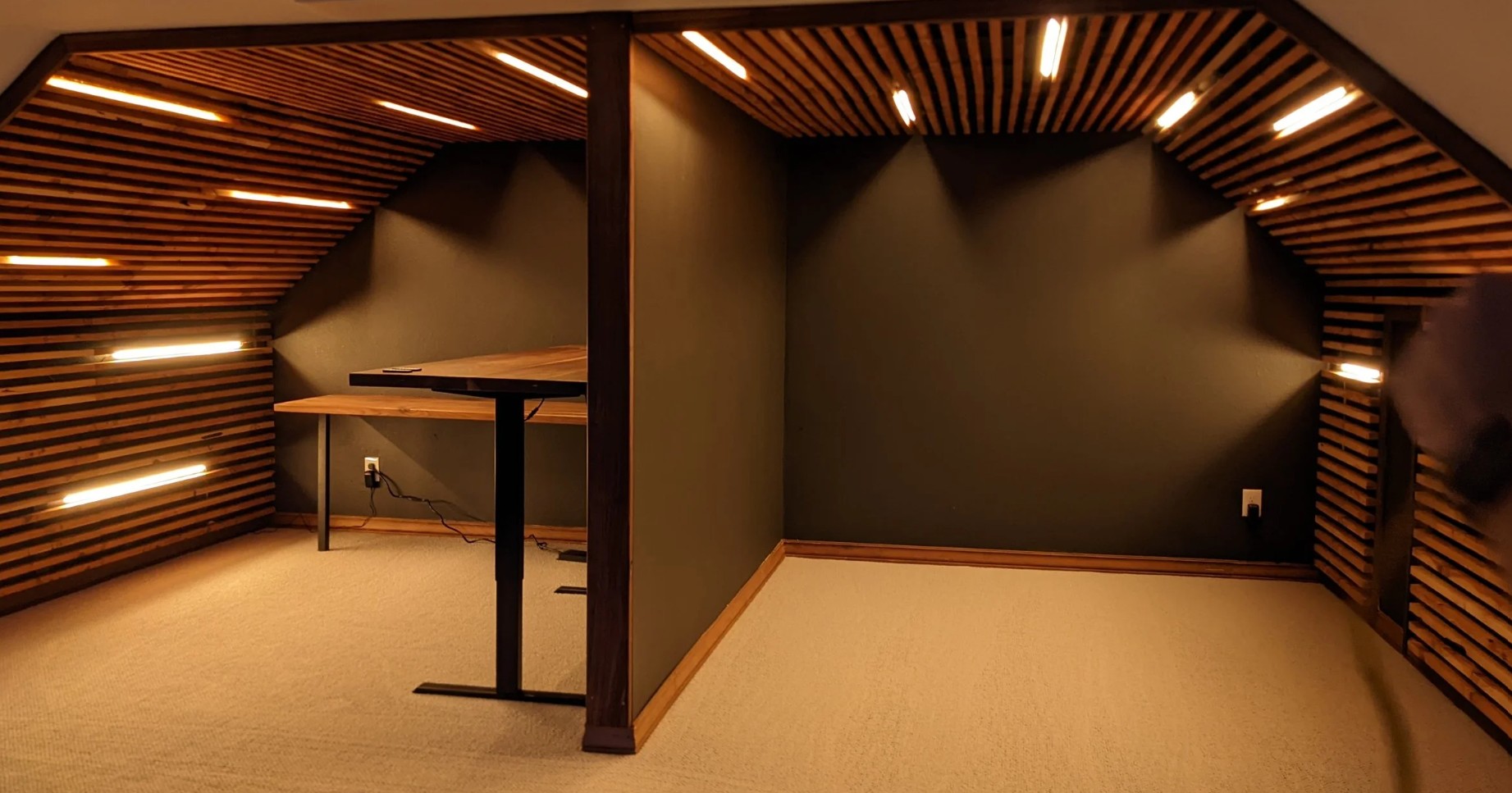 Custom slatted wood attic remodel with LED lighting