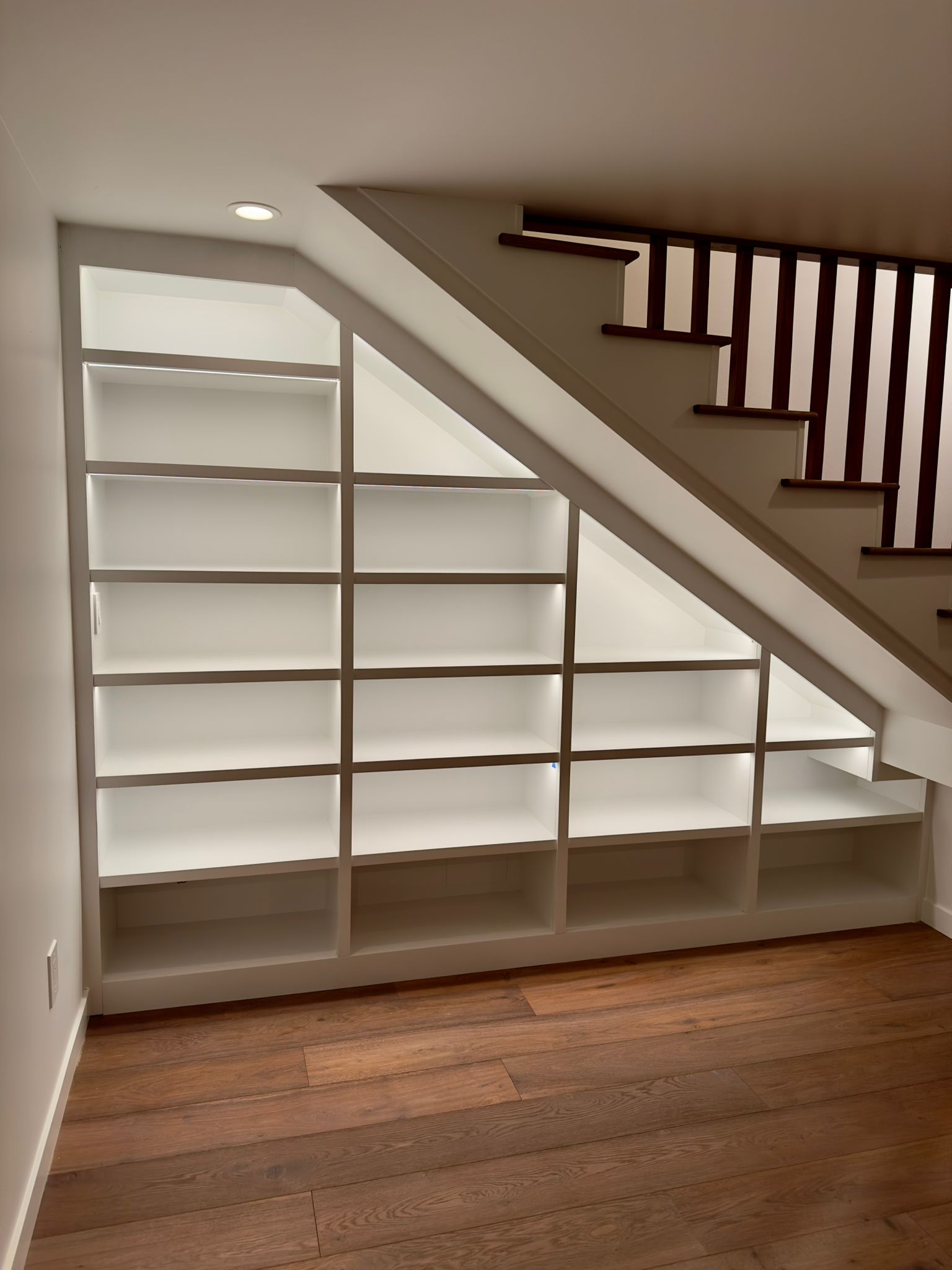 Under-stair built-in shelving unit
